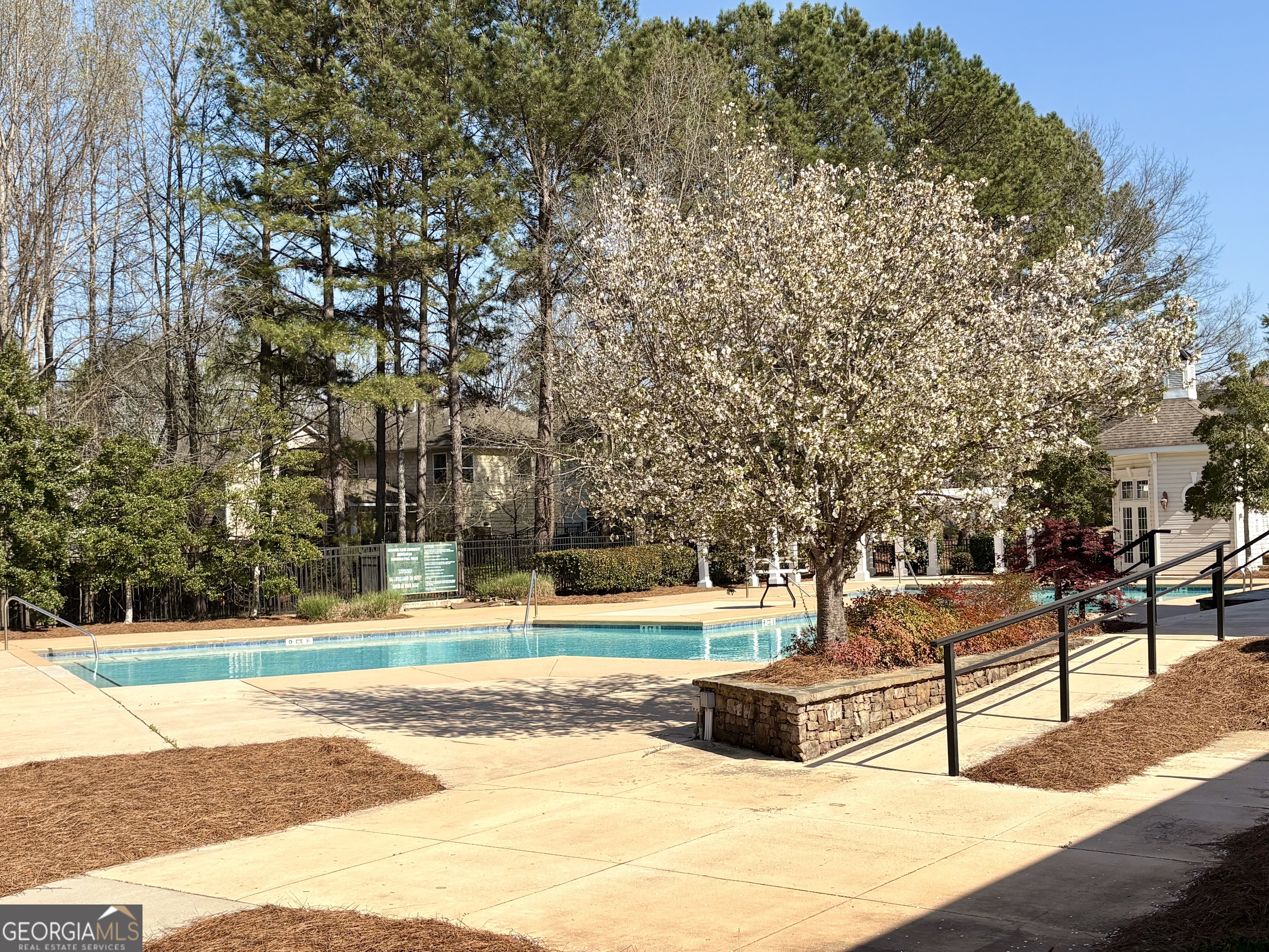 35 Timber Lane Newnan, GA 30265 - Photo 42 of 51 a bench is sitting in the middle of a yard