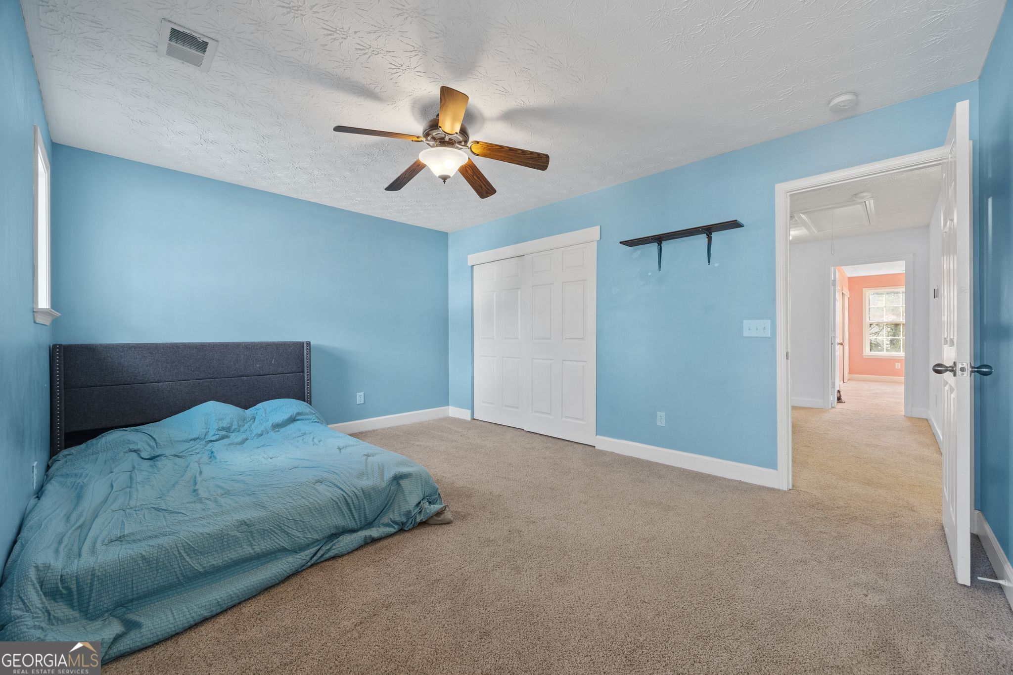 35 Timber Lane Newnan, GA 30265 - Photo 45 of 51 a bedroom with a bed and a chandelier fan