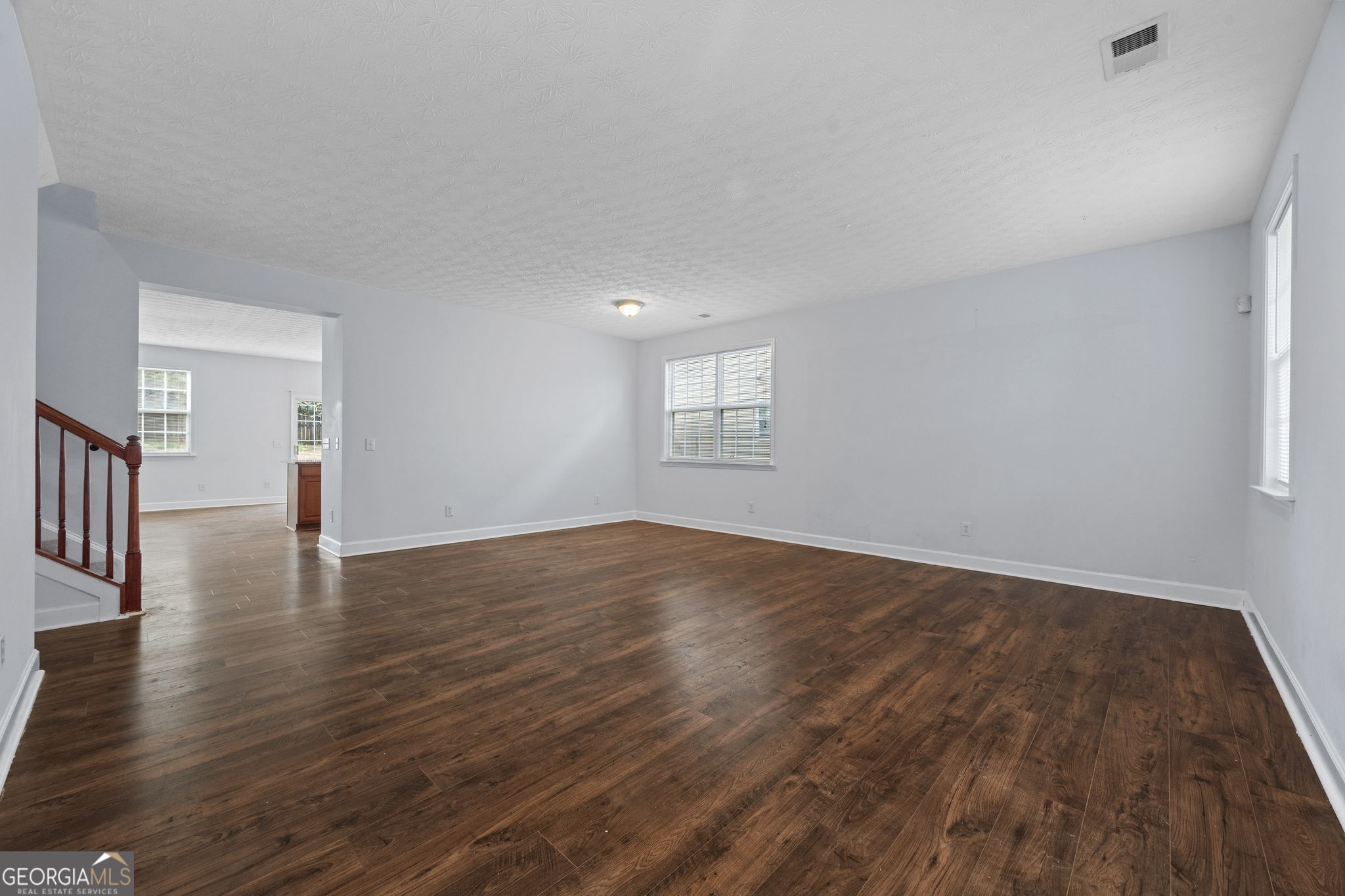 35 Timber Lane Newnan, GA 30265 - Photo 5 of 51 a view of empty room with wooden floor and fan