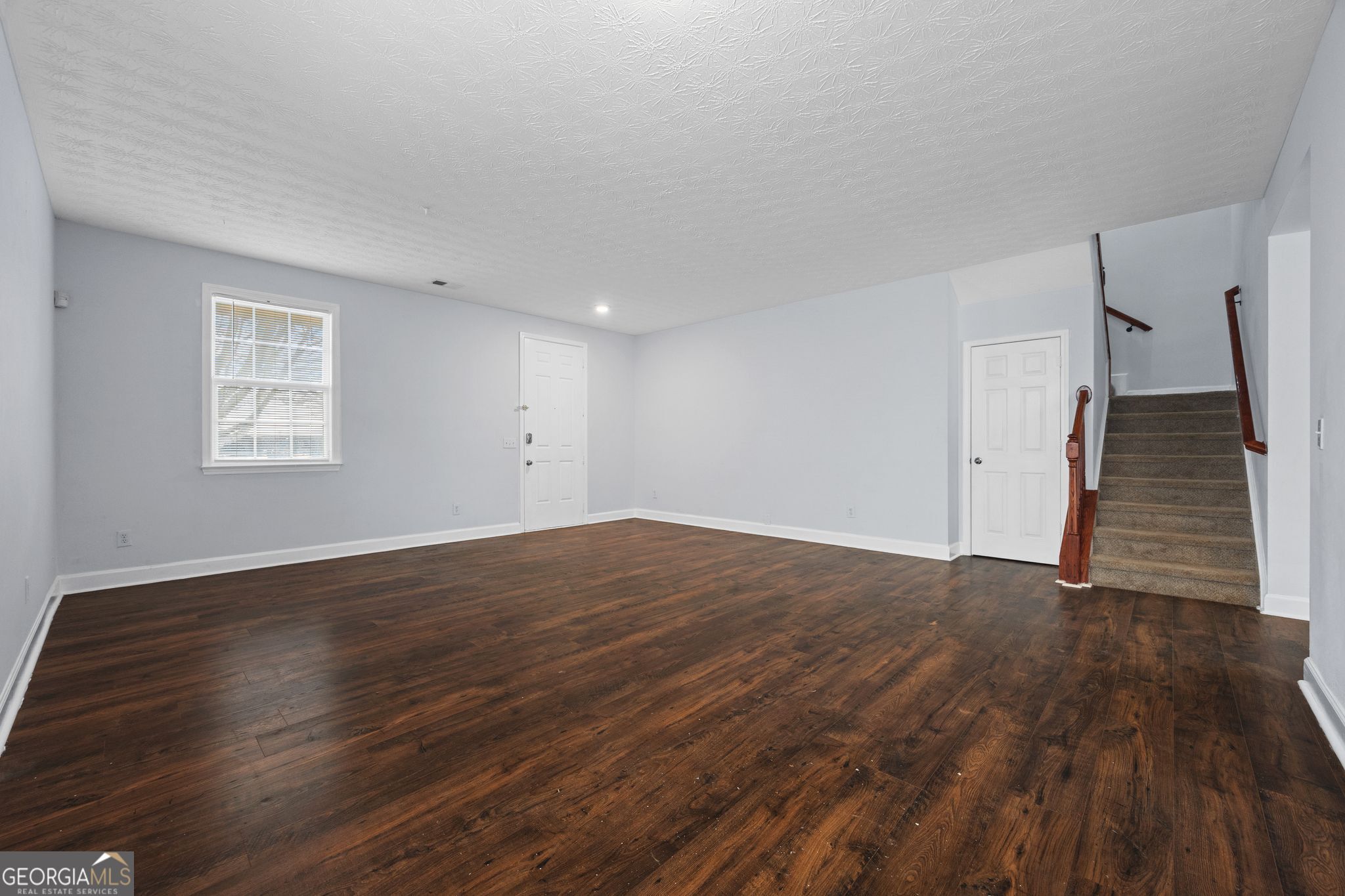 35 Timber Lane Newnan, GA 30265 - Photo 6 of 51 a view of empty room with wooden floor