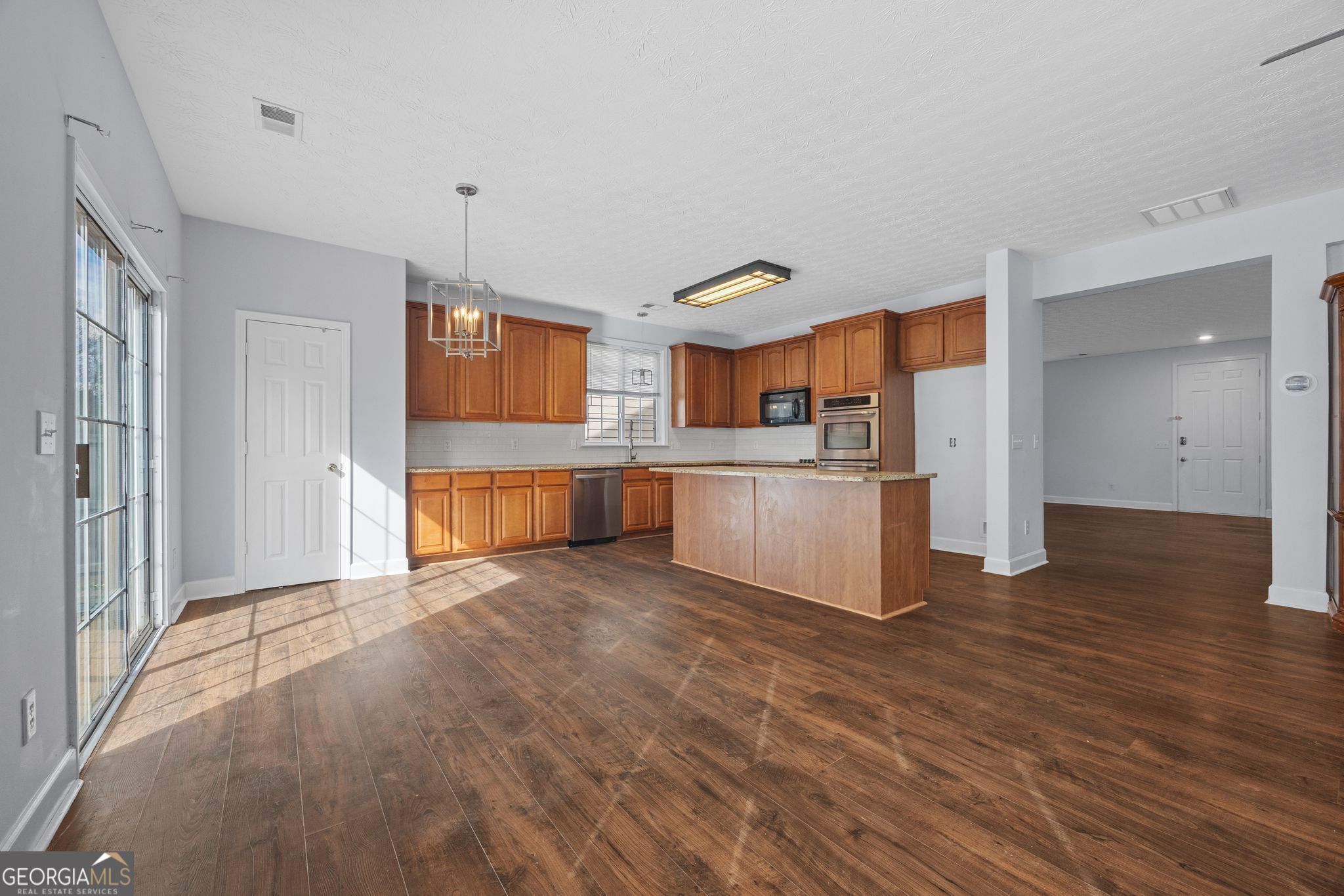 35 Timber Lane Newnan, GA 30265 - Photo 8 of 51 a view of a kitchen with refrigerator and white cabinets