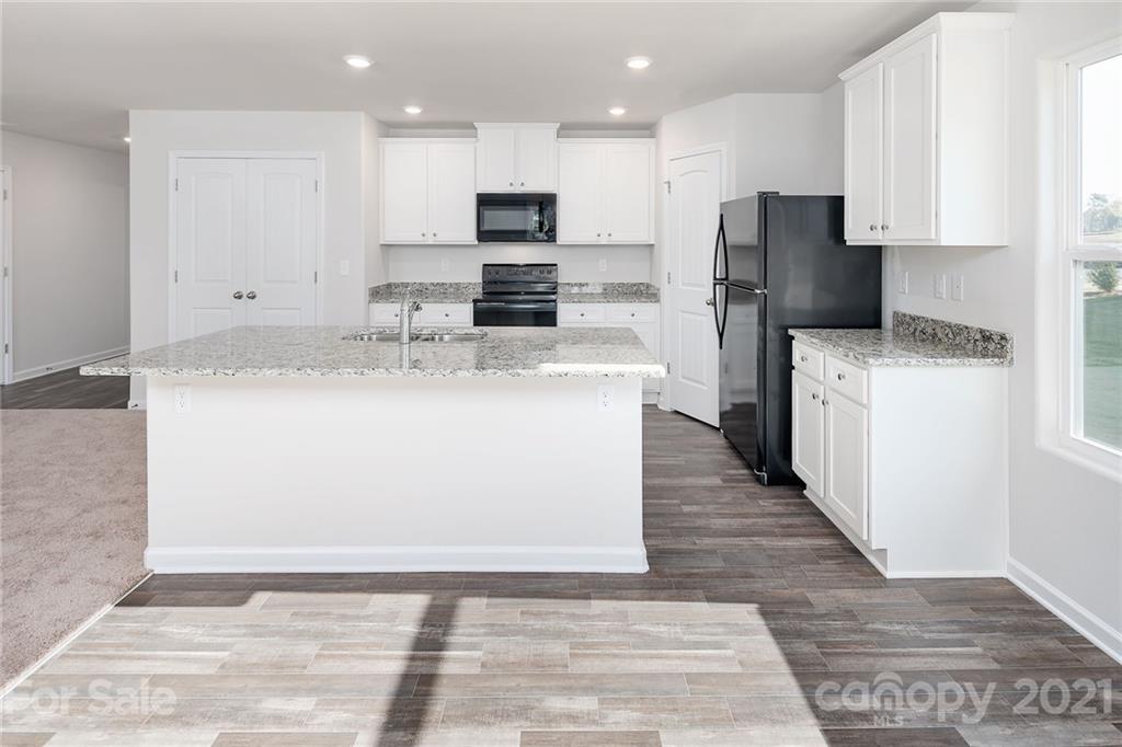 281 Rosedale Street Kings Mountain, NC 28086 - Photo 5 of 19 a kitchen with stainless steel appliances a refrigerator sink and microwave