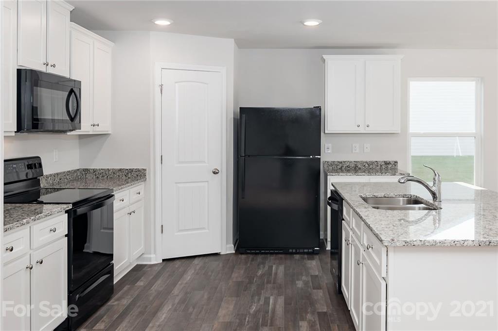 281 Rosedale Street Kings Mountain, NC 28086 - Photo 7 of 19 a kitchen with a sink stove and refrigerator