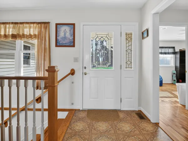 a kitchen with stainless steel appliances granite countertop a stove a sink dishwasher and cabinets with wooden floor