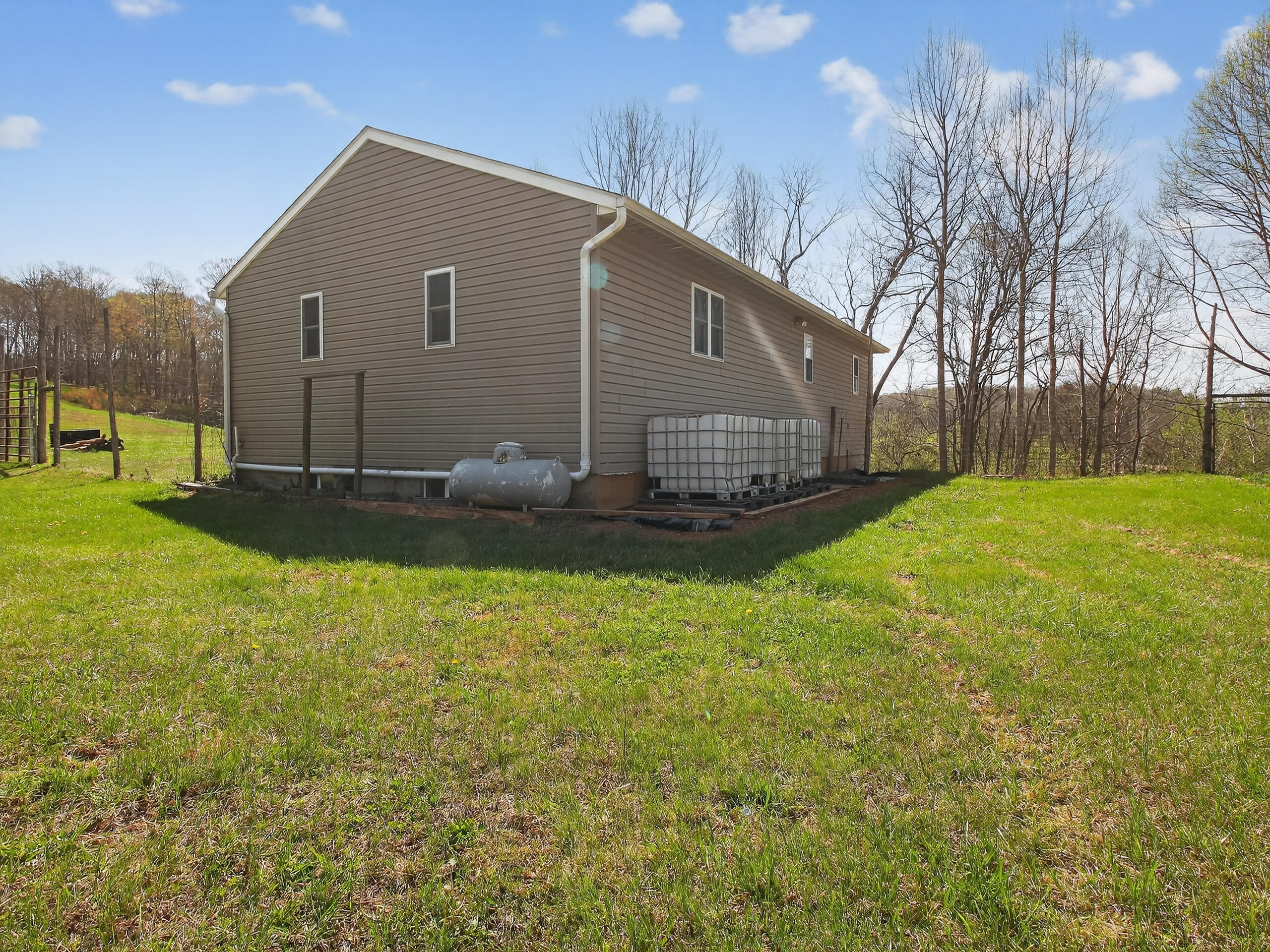 498 Meeks Road Penhook, VA 24137 - Photo 65 of 71 a backyard of a house with lots of green space