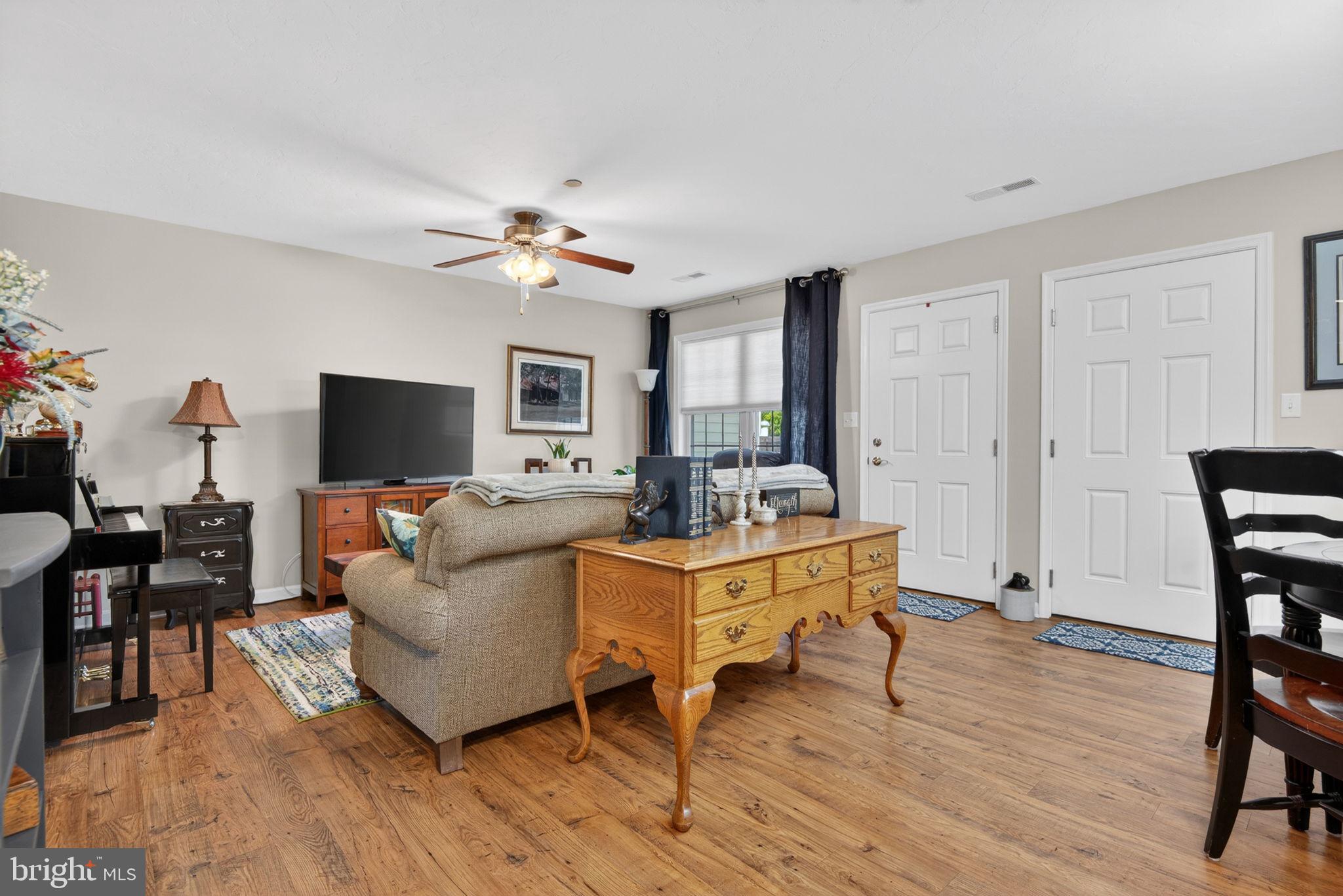 1332 Pleasant View Drive, Unit 75 Spring Grove, PA 17362 - Photo 11 of 26 a living room with furniture a flat screen tv and a table