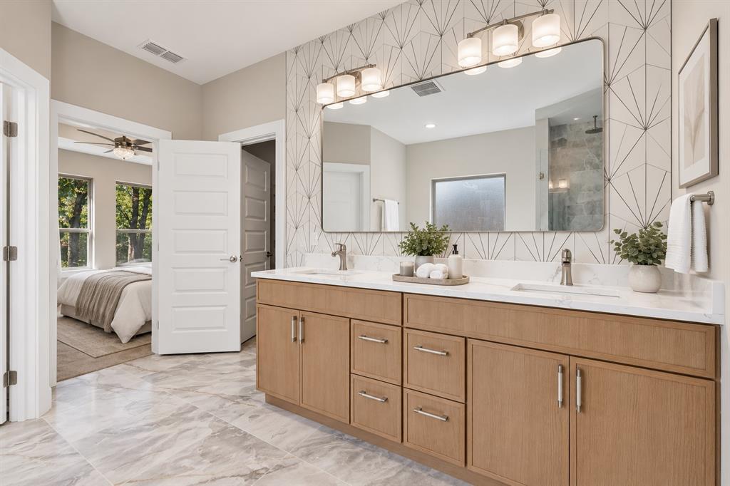 108 Winding Way Azle, TX 76020 - Photo 15 of 38 Dual vanity with white countertops, light wood-finish cabinetry, and brushed nickel hardware
