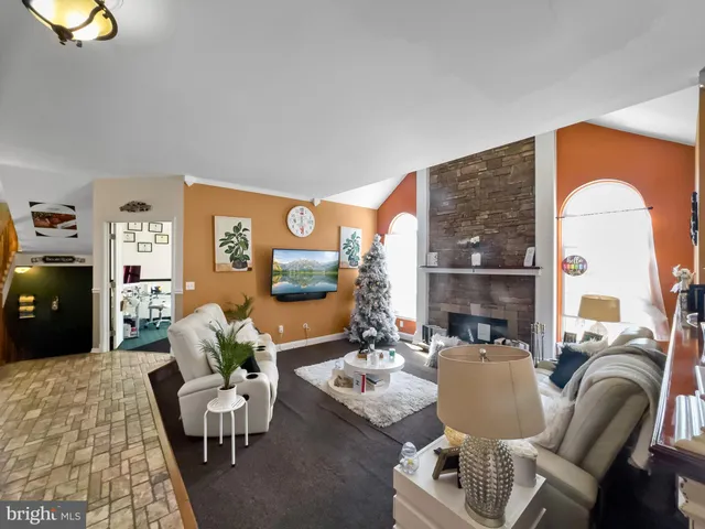 a kitchen with stainless steel appliances granite countertop a refrigerator and stove