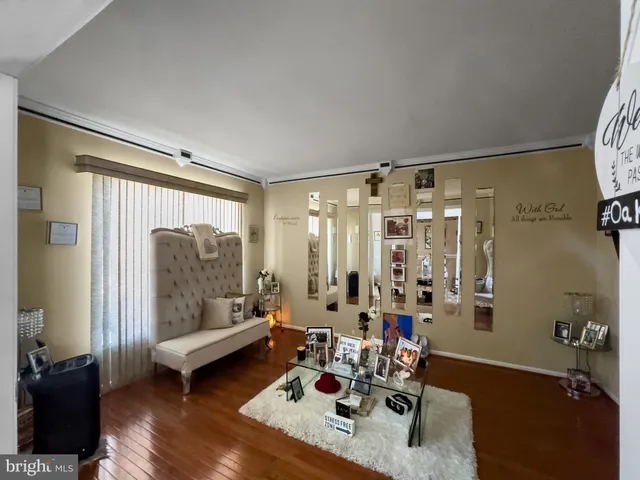 a bedroom with a bed a window and dresser