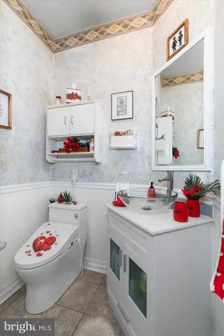 a bedroom with a bed and a mirror