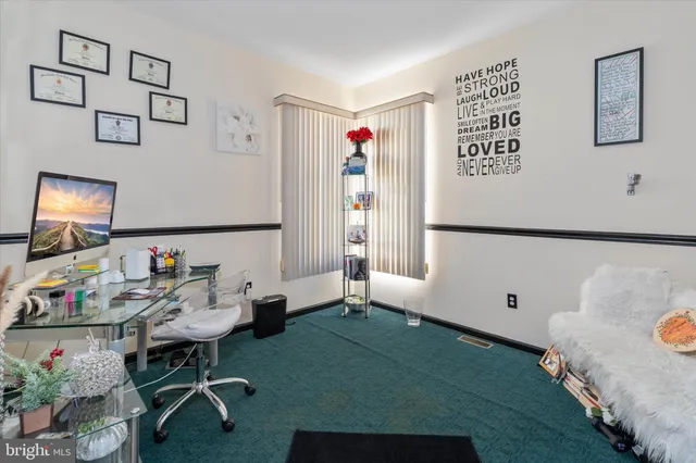 a bathroom with a granite countertop sink a toilet and a mirror