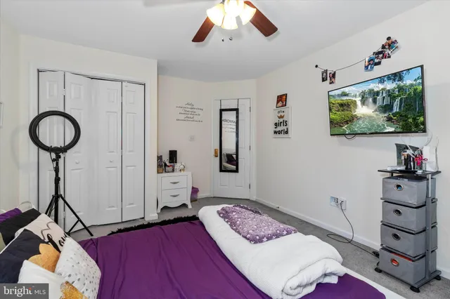 an aerial view of a house with swimming pool garden and patio