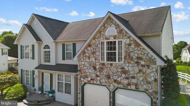 a living room with furniture fireplace and window