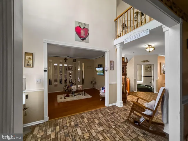 a living room with furniture and flowers