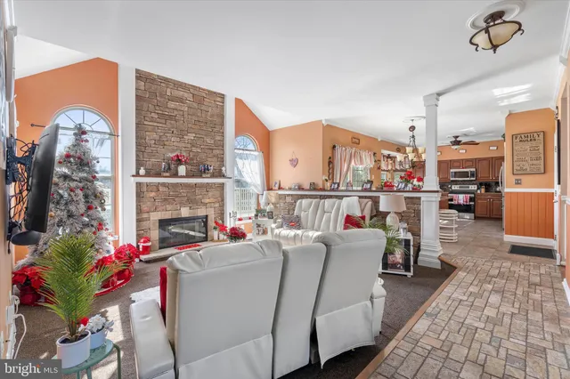 a kitchen island with stainless steel appliances kitchen island granite countertop a sink and a refrigerator