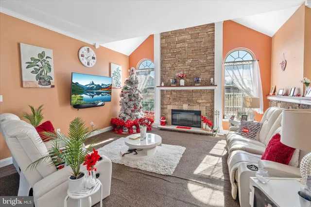 a kitchen with stainless steel appliances granite countertop a refrigerator stove microwave and sink