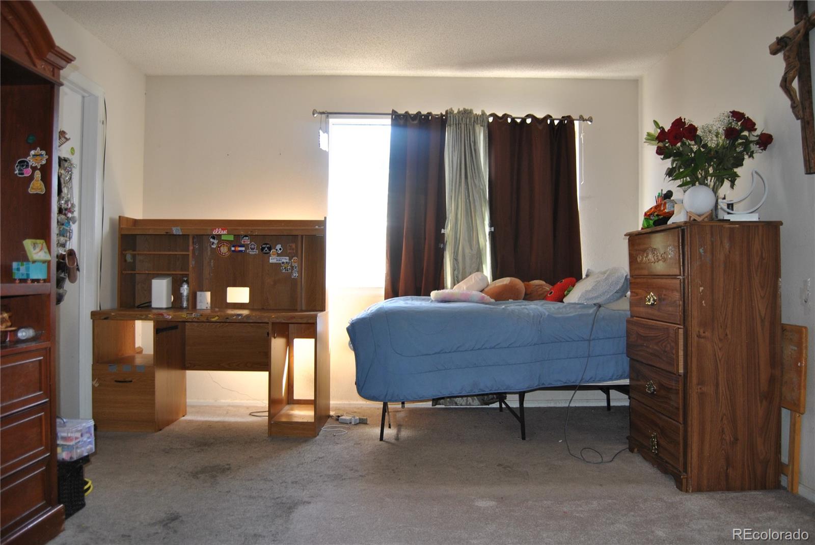 1904 Eagle Street Aurora, CO 80011 - Photo 13 of 27 a room with furniture and a potted plant