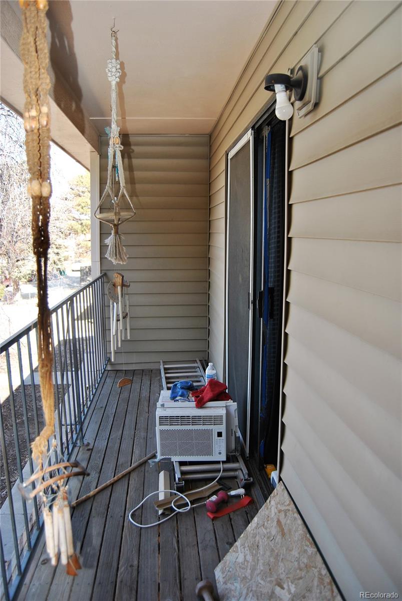 1904 Eagle Street Aurora, CO 80011 - Photo 2 of 27 a living room with furniture and a wooden floor