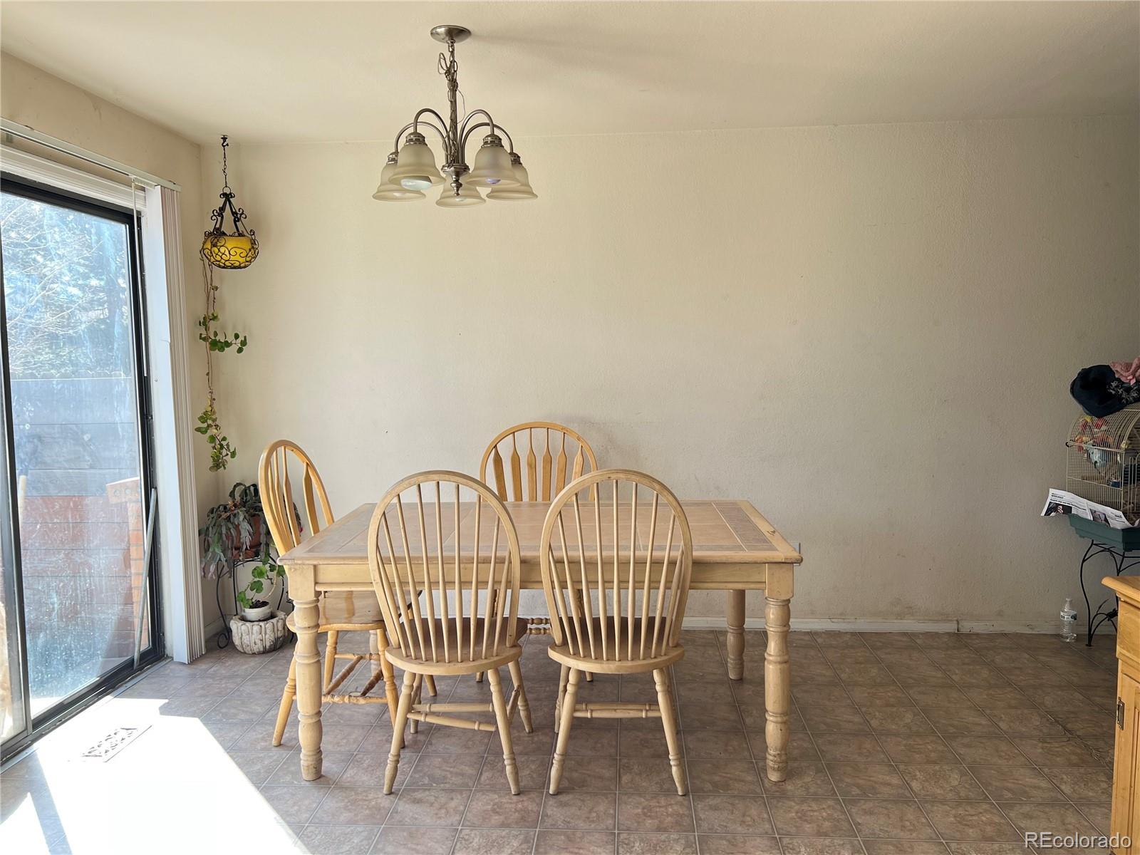 1904 Eagle Street Aurora, CO 80011 - Photo 25 of 27 a view of a dining room with furniture