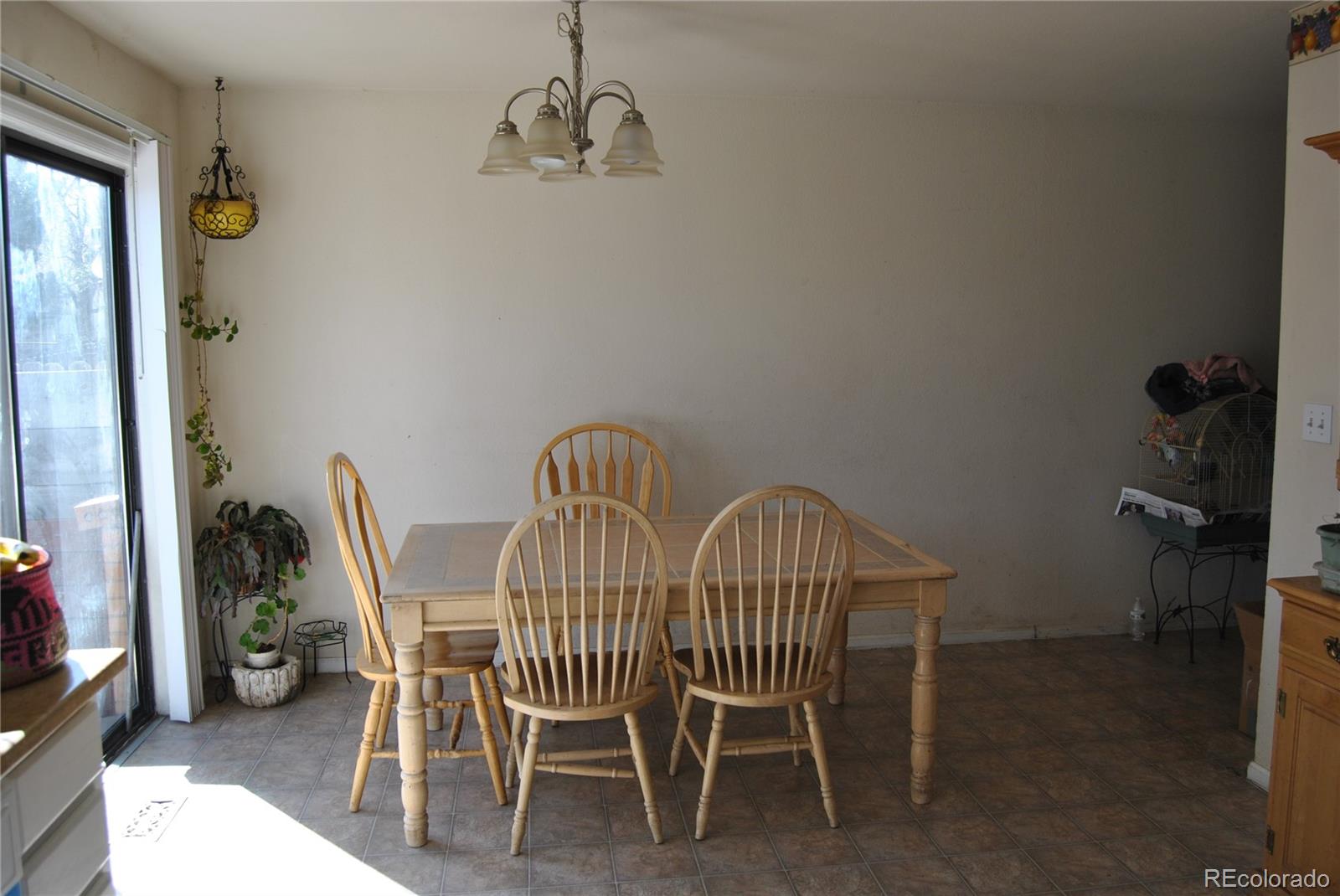 1904 Eagle Street Aurora, CO 80011 - Photo 4 of 27 a view of a dining room with furniture