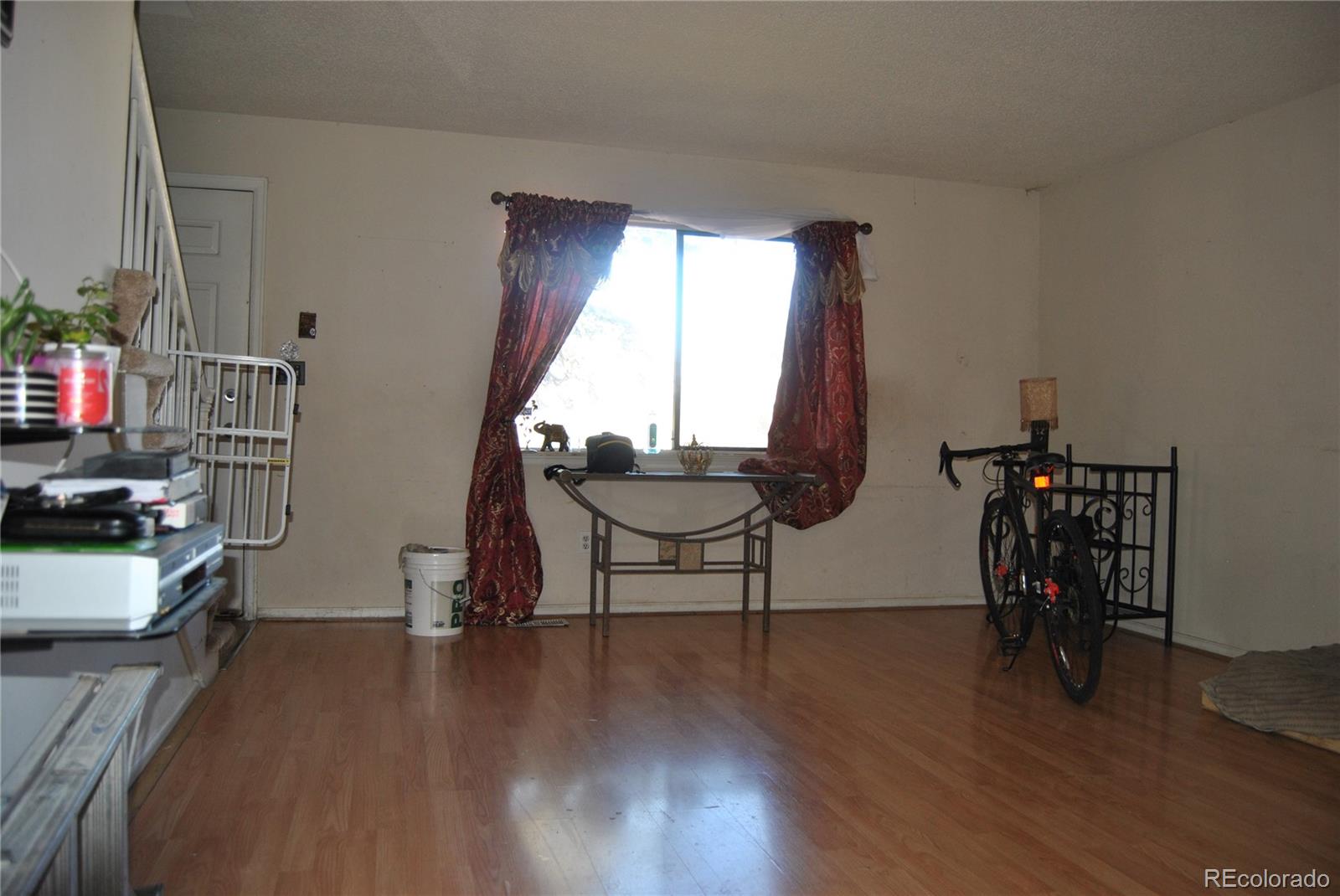 1904 Eagle Street Aurora, CO 80011 - Photo 5 of 27 a living room with furniture and a window