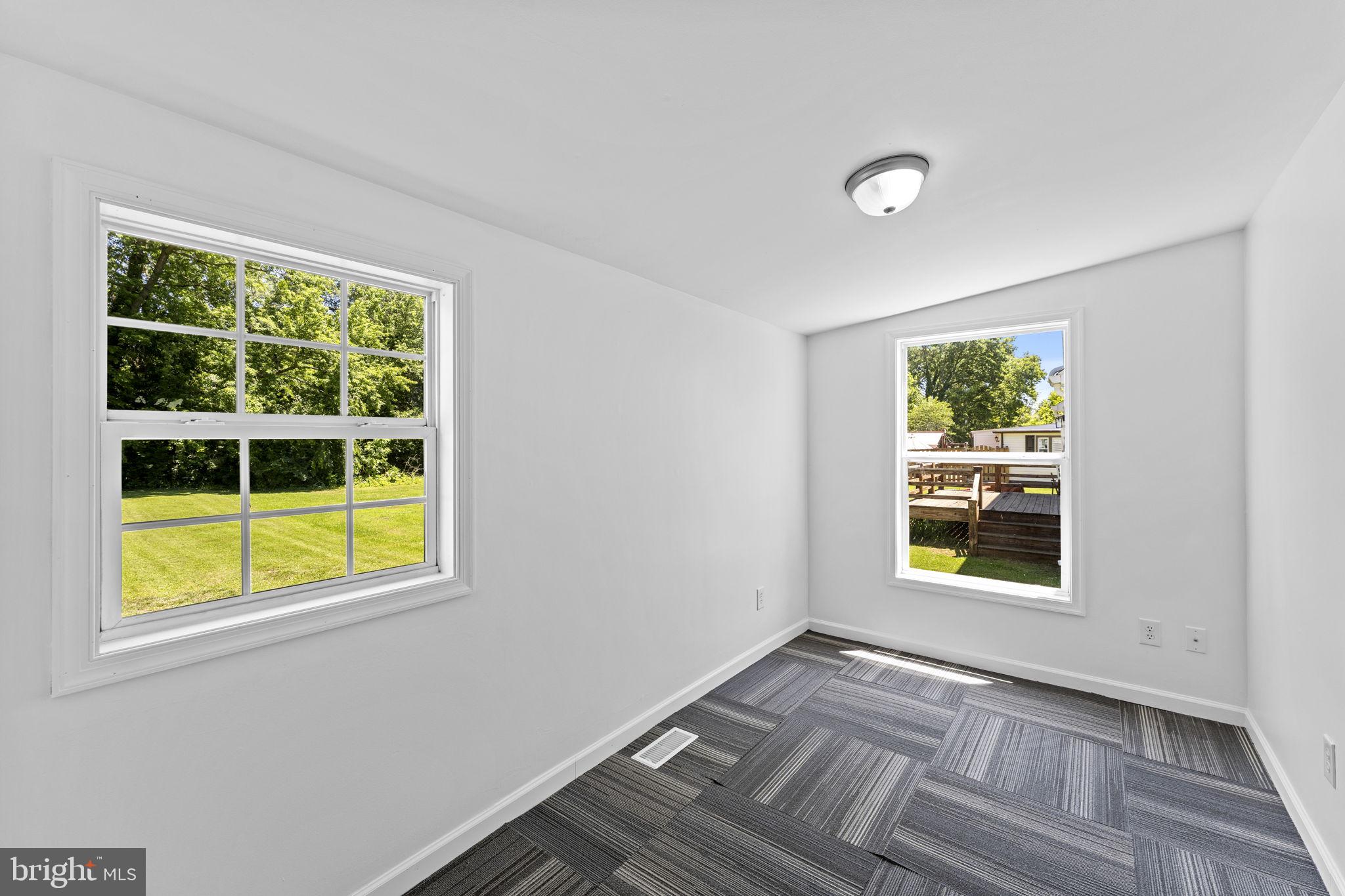 216 Walnut Street Berryville, VA 22611 - Photo 31 of 36 a view of an empty room with a window