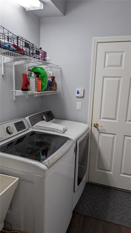 6264 Wingspan Way Bradenton, FL 34203 - Photo 18 of 27 a kitchen with a stove and wooden floor