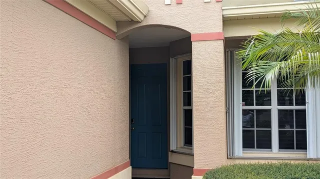 a view of a door and a window