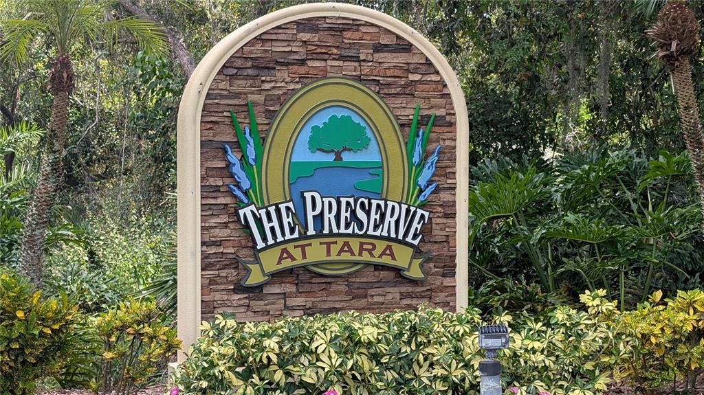 6264 Wingspan Way Bradenton, FL 34203 - Photo 5 of 27 a view of a wooden door with a garden