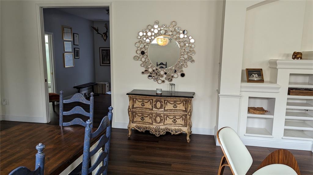 6264 Wingspan Way Bradenton, FL 34203 - Photo 6 of 27 a view of a workspace with furniture and wooden floor