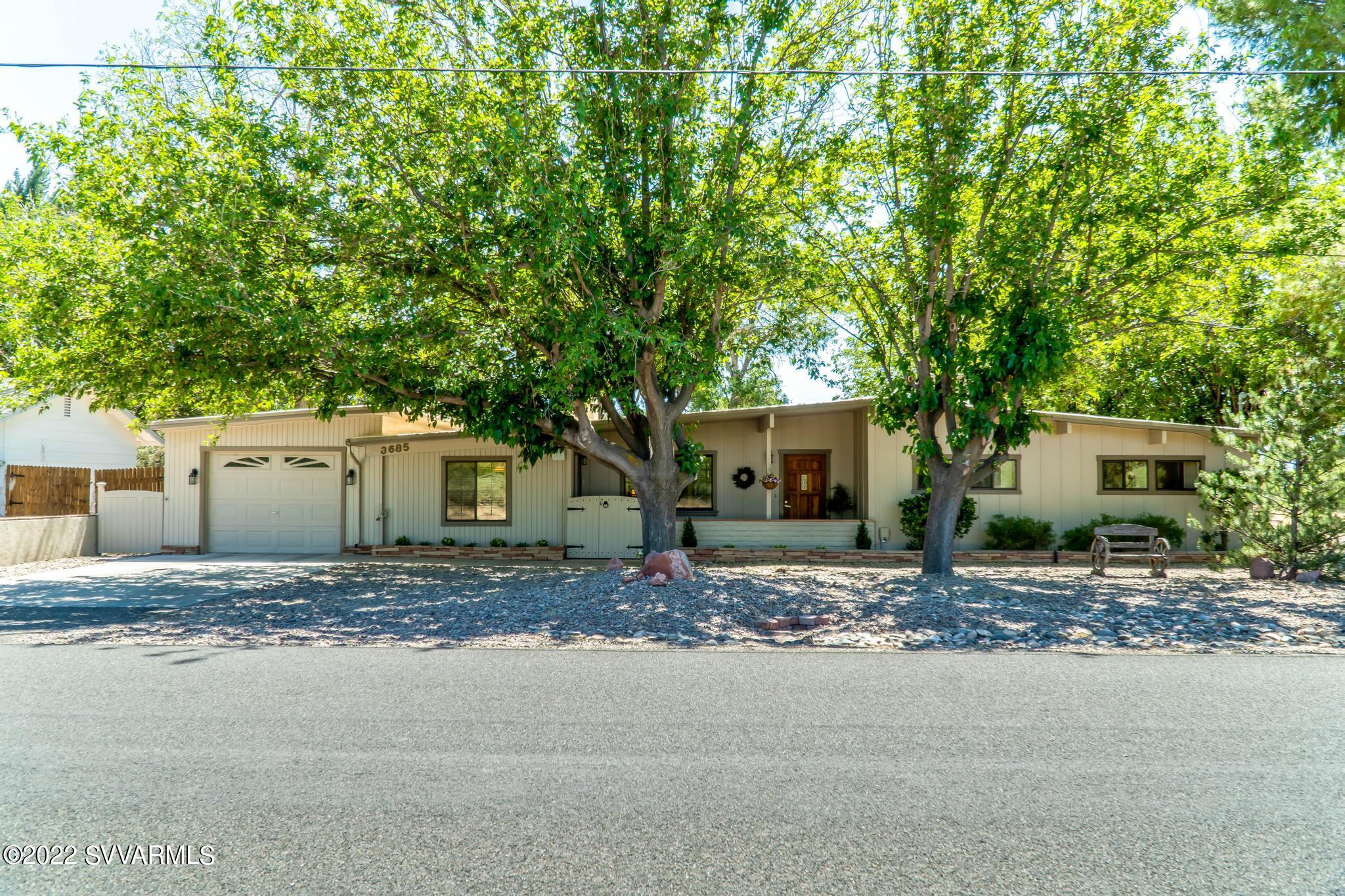 3685 East Rimrock Drive Rimrock, AZ 86335 - Photo 1 of 47 a house with trees in front of it