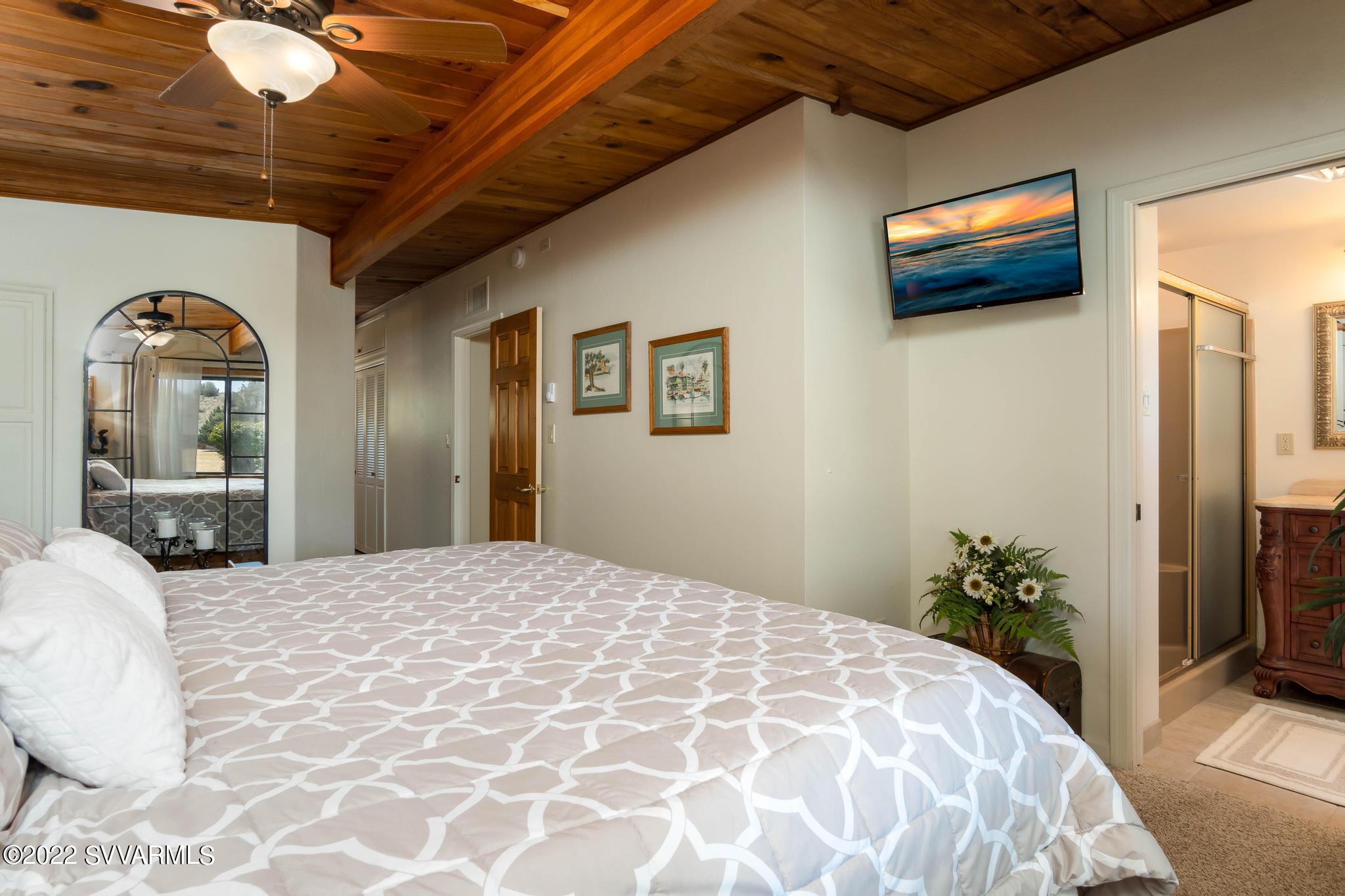 3685 East Rimrock Drive Rimrock, AZ 86335 - Photo 19 of 47 a bedroom with a bed and a painting on the wall