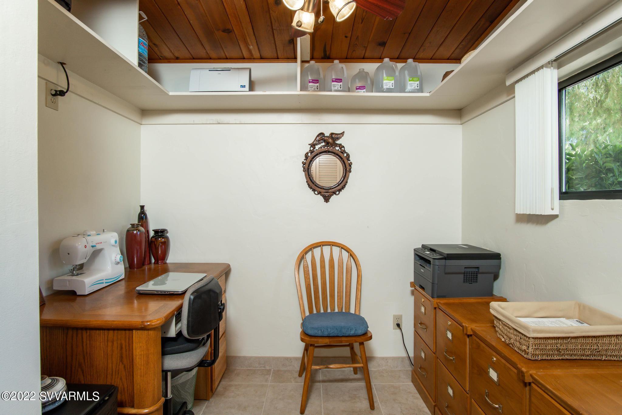 3685 East Rimrock Drive Rimrock, AZ 86335 - Photo 21 of 47 a view of a workspace with furniture and a window