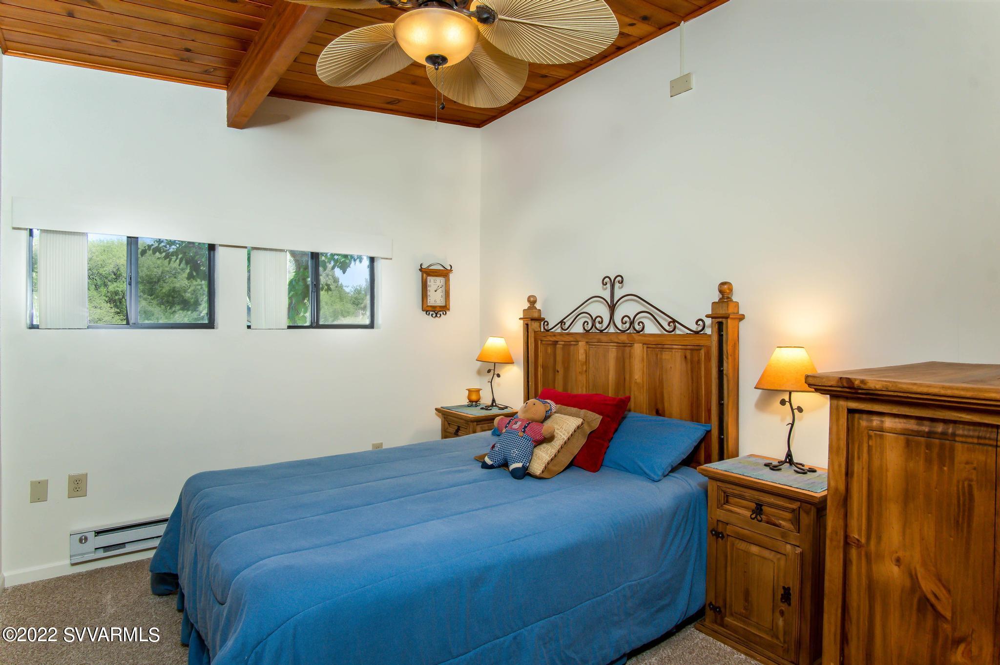 3685 East Rimrock Drive Rimrock, AZ 86335 - Photo 27 of 47 a bedroom with a bed and wooden floor