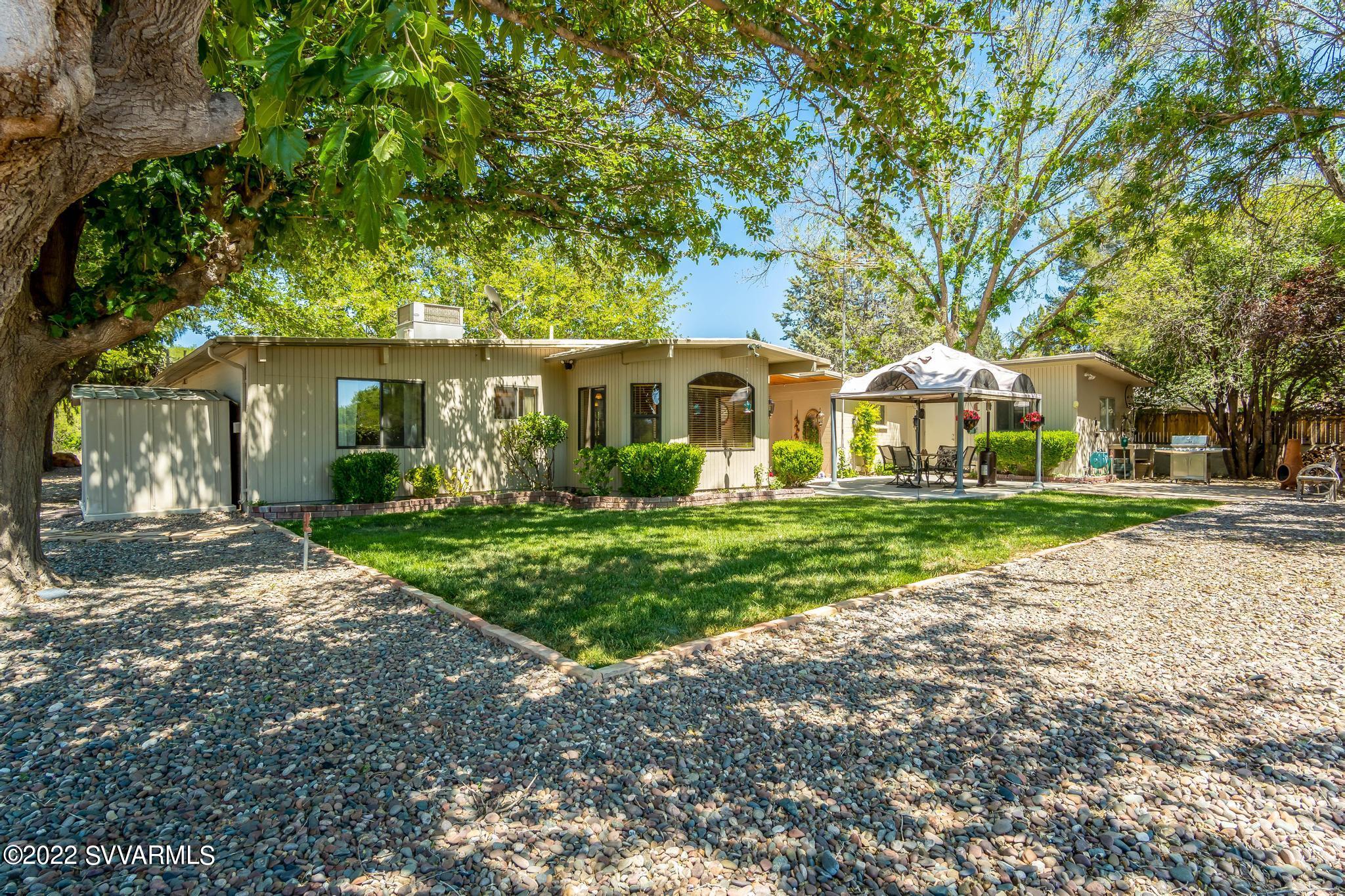 3685 East Rimrock Drive Rimrock, AZ 86335 - Photo 31 of 47 a front view of a house with garden