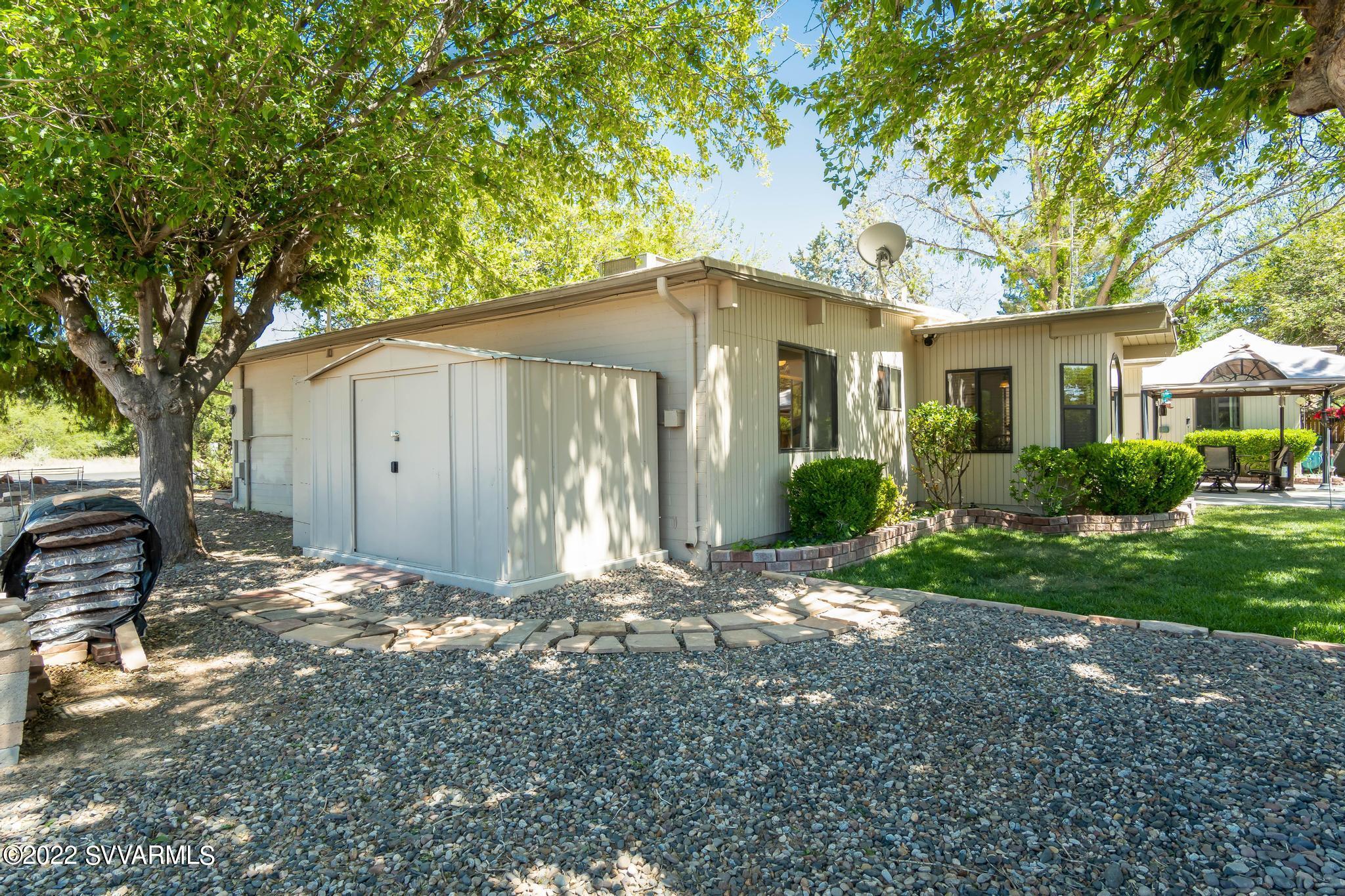 3685 East Rimrock Drive Rimrock, AZ 86335 - Photo 33 of 47 a front view of a house with garden
