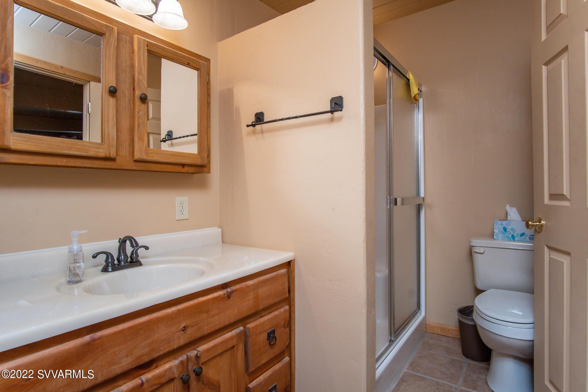 3685 East Rimrock Drive Rimrock, AZ 86335 - Photo 35 of 47 a bathroom with a sink a toilet and shower