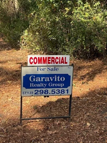 a sign that is on a brick wall