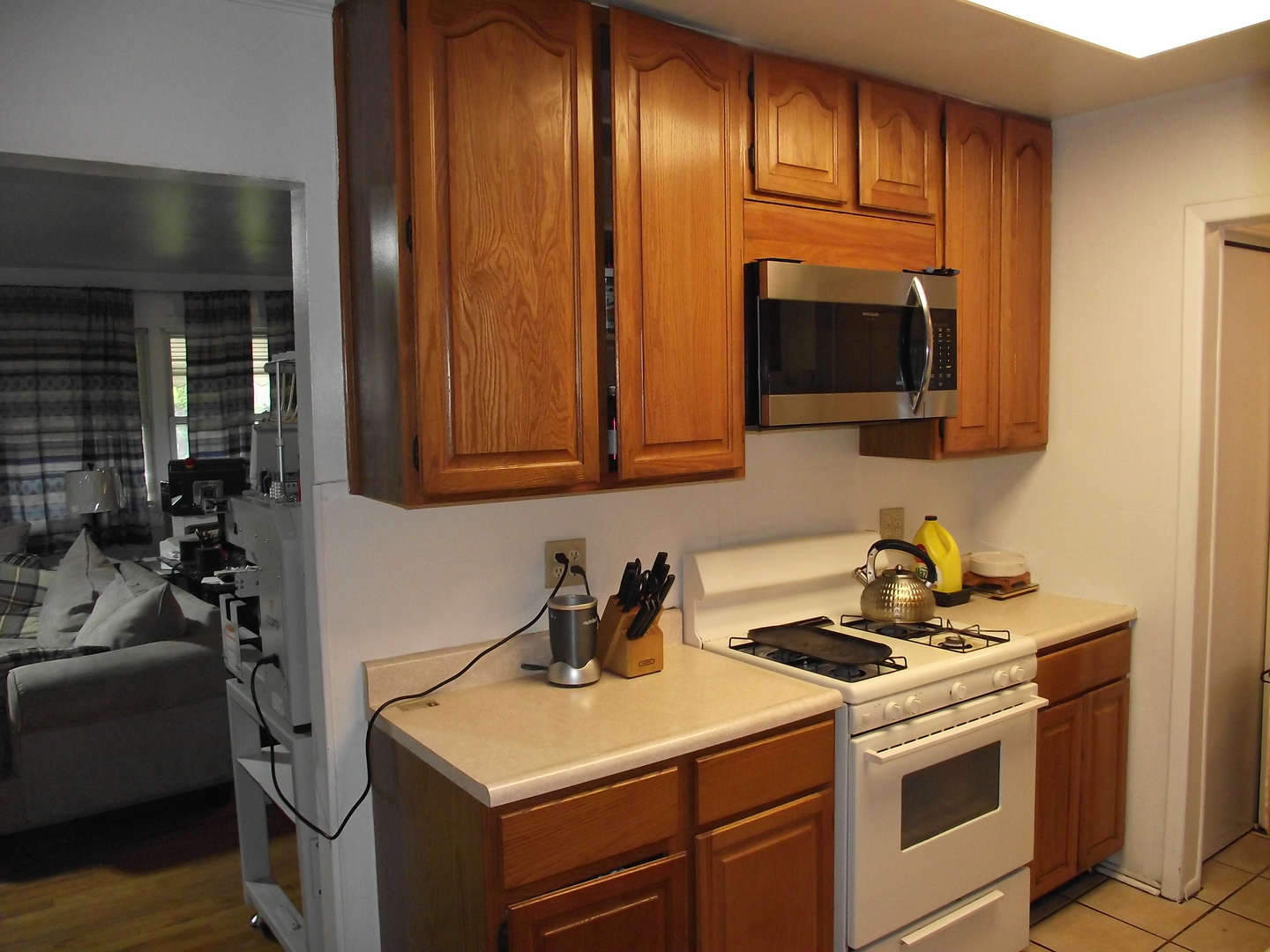 179 Thornhurst Road Bolingbrook, IL 60440 - Photo 4 of 21 a kitchen with stainless steel appliances wooden cabinets and a stove top oven