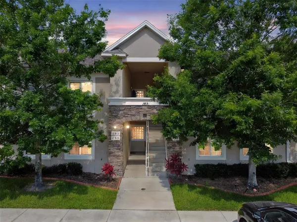 a front view of a house with garden