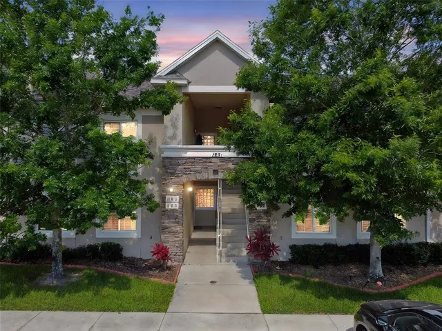 a front view of a house with garden