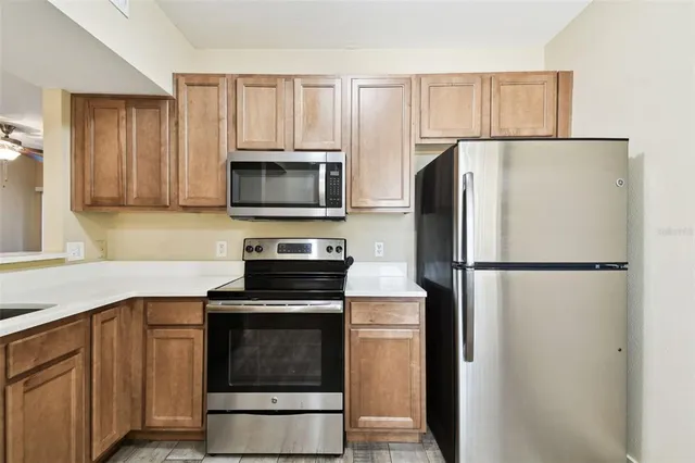 a bedroom with a bed and a ceiling fan