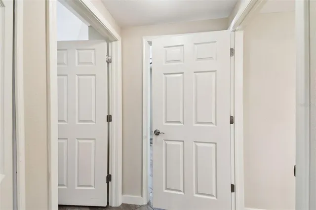 a front view of a house with a yard and tree s