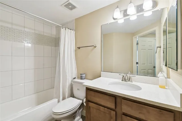 a view of a patio with dining table and chairs with wooden floor