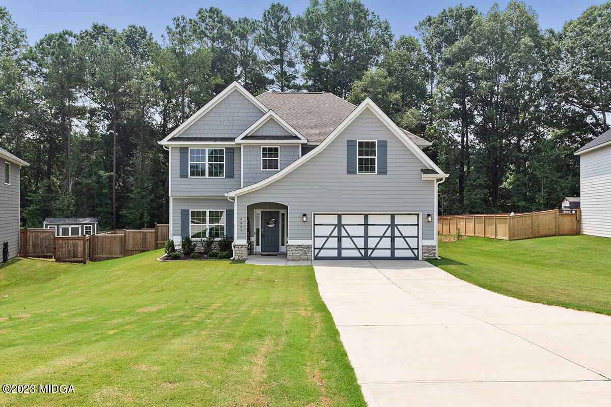4227 Cornwall Drive Forsyth, GA 31029 - Photo 1 of 27 a view of a house with a yard and sitting area