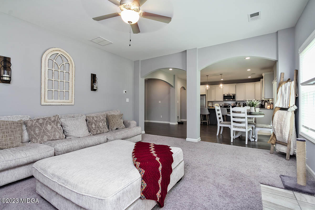 4227 Cornwall Drive Forsyth, GA 31029 - Photo 11 of 27 a living room with furniture and kitchen view