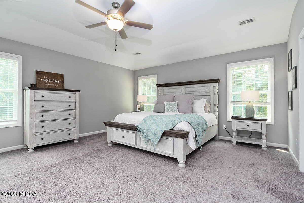 4227 Cornwall Drive Forsyth, GA 31029 - Photo 19 of 27 a bed room with a bed and a tv