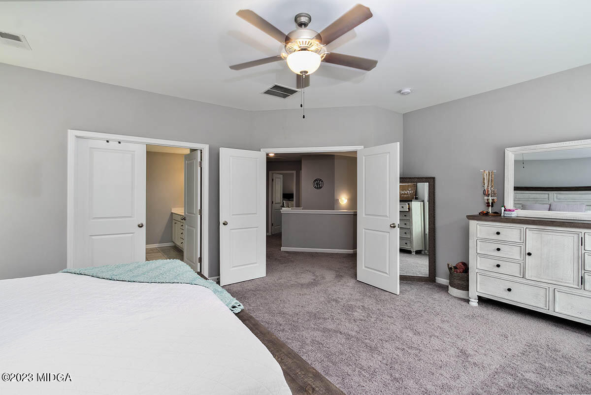 4227 Cornwall Drive Forsyth, GA 31029 - Photo 20 of 27 a bedroom with a bed and a ceiling fan