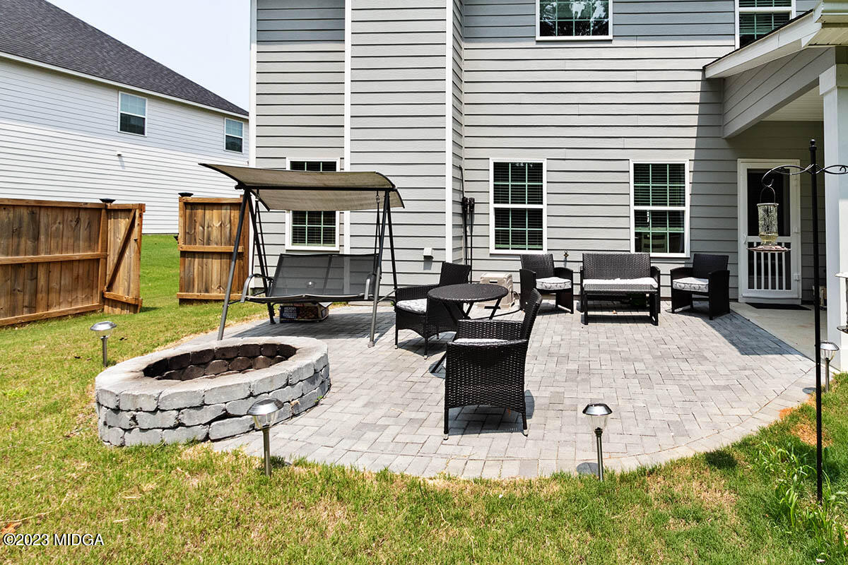 4227 Cornwall Drive Forsyth, GA 31029 - Photo 26 of 27 a living room with furniture and a fireplace