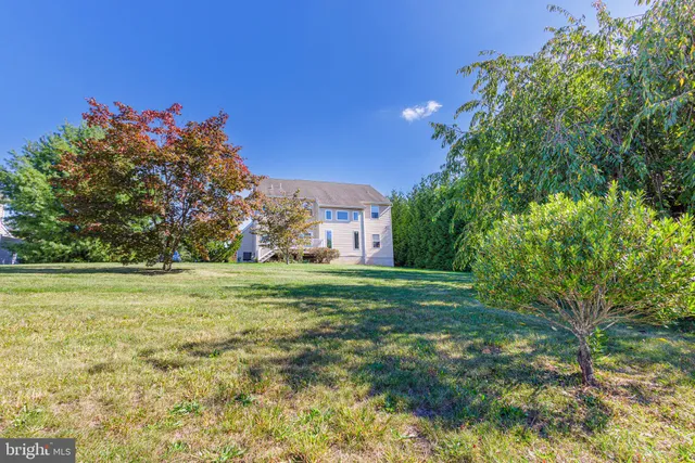 a view of a big yard with a house